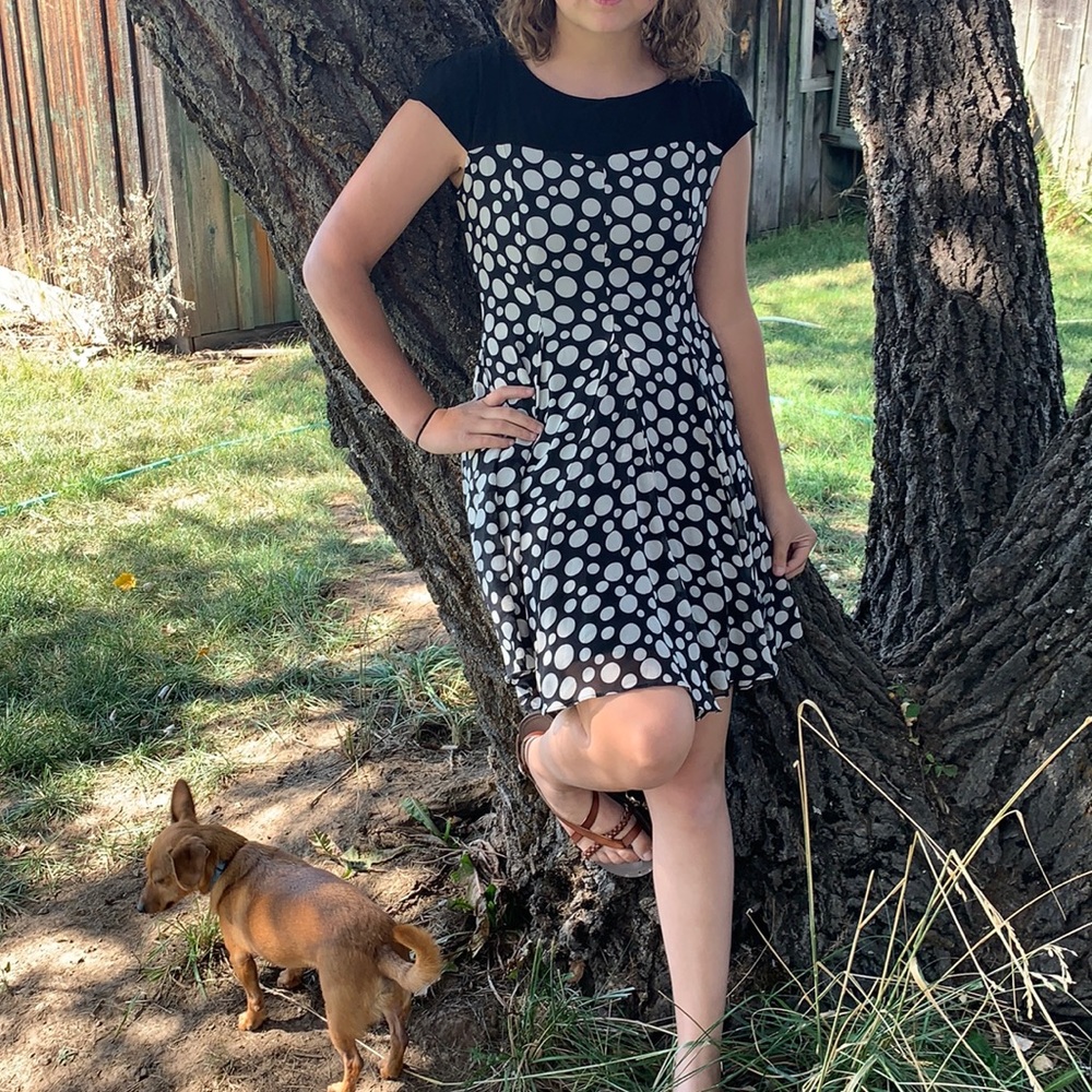 A flowy black and white polkadotted dress.